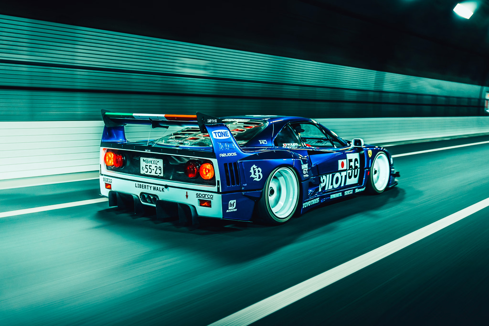 Blue race car in motion